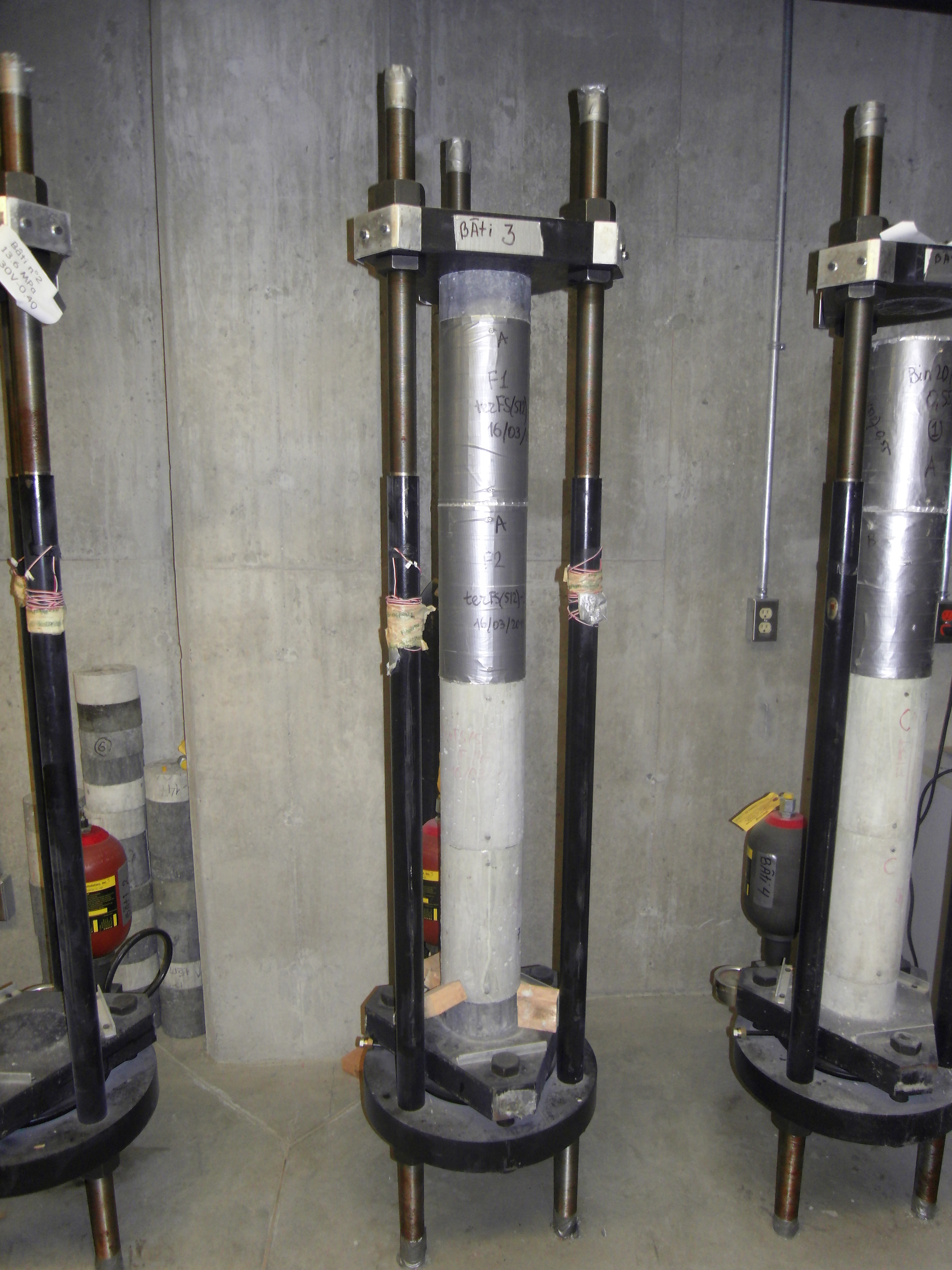 These are fabricated pieces of specialized equipment to test the creep measurement of high-strength concrete.